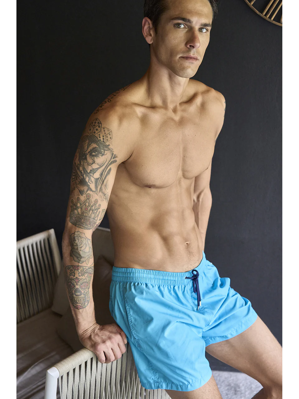 Men’s swim trunks in light solid turquoise fabric