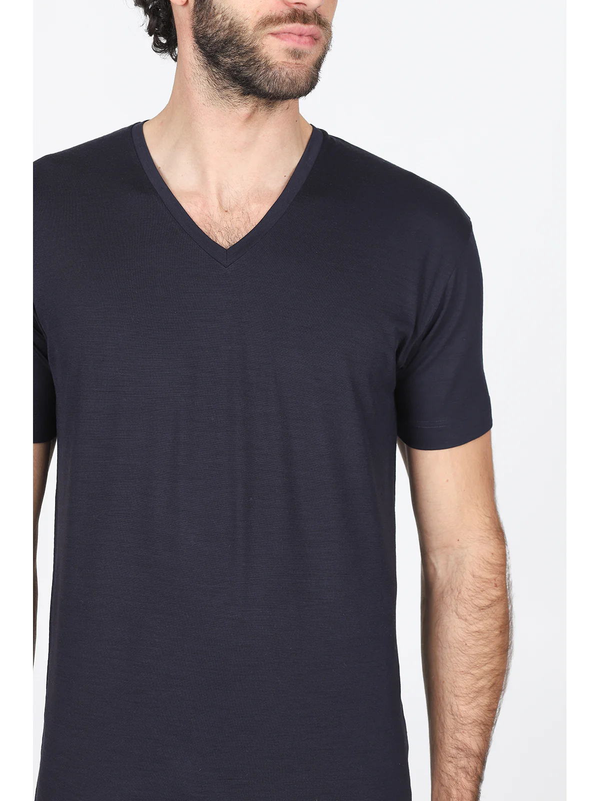 Elegant knit in pure blue merino wool with a v-neckline
